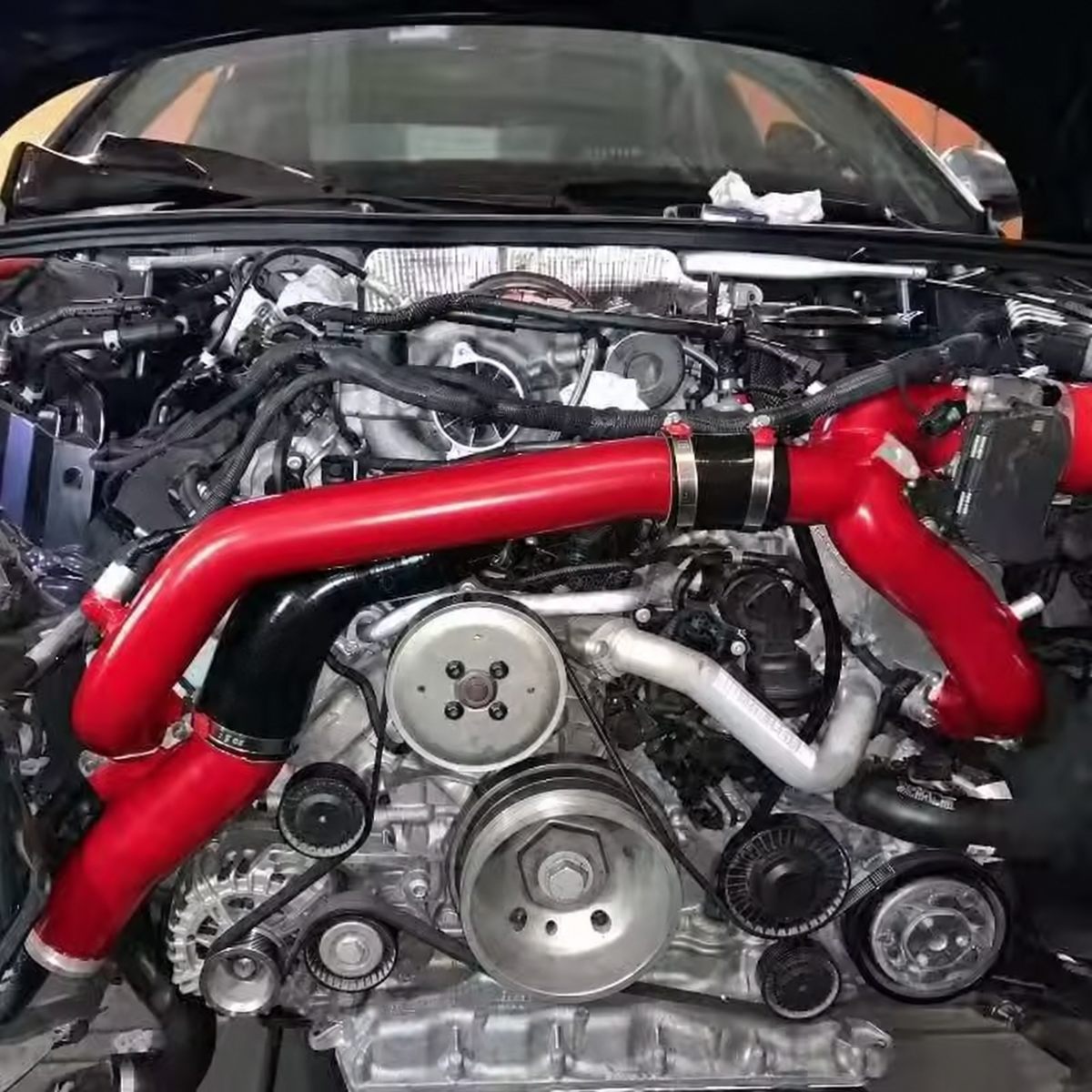 Red performance charge pipe kit installed in Audi S4 B9 EA839 3.0 TFSI engine bay
