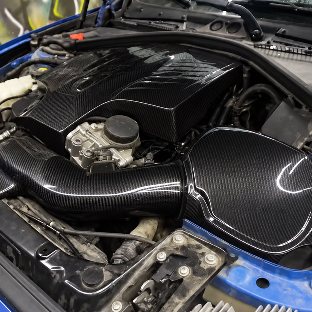 BMW M2 F87 N55 dry carbon fiber cold air intake system installed in the engine bay