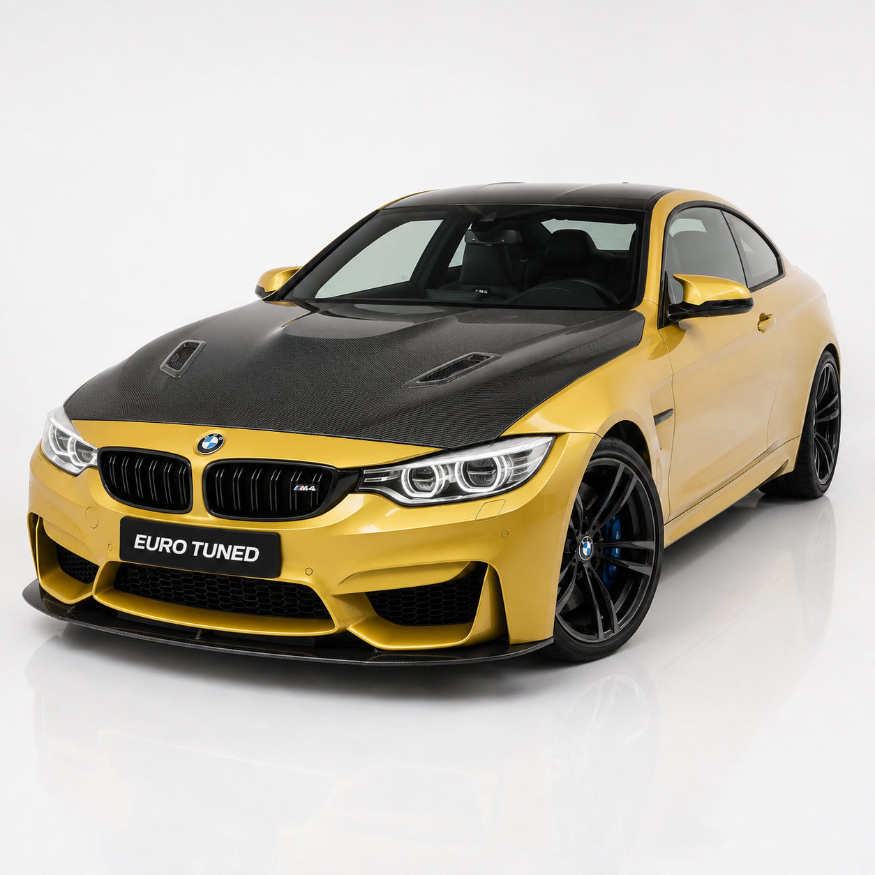 Universal carbon fiber hood vent trims installed on BMW