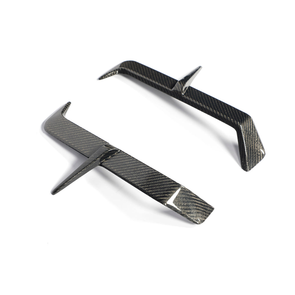 BMW M5 G90 G99 carbon fiber rear bumper canards angle view