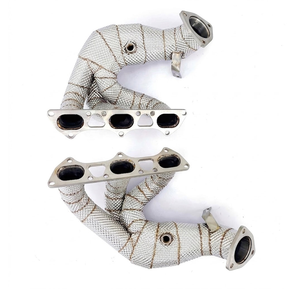 Porsche 718 Cayman GT4 RS 4.0L racing exhaust headers with heat shields and cylinder head flanges