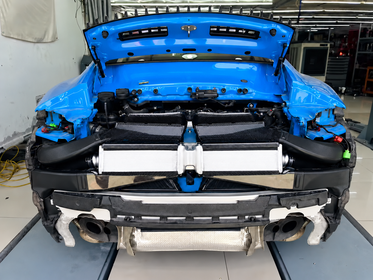 Porsche 911 992 Turbo S performance intercooler installed behind rear bumper